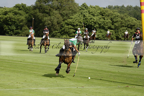 Jaeger Le Coultre (black)  v Wairakei Pastoral (white) in a Jaeger Le Coultre Holden White Cup polo match played on 29 July 2013 at Cowdray Park Polo Club on Brooksfieldwww.polopictures.co.uk