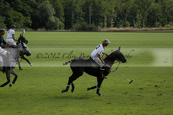 Pandas (white) v Home Farm (navy) in a Park House West Sussex Cup Polo match on Brooksfield at Cowdray Park Polo Club on Friday 30 August 2013. 2013.08.30 www.polopictures.co.uk