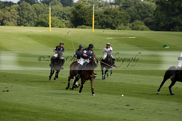 Pandas (white) v Home Farm (navy) in a Park House West Sussex Cup Polo match on Brooksfield at Cowdray Park Polo Club on Friday 30 August 2013. 2013.08.30 www.polopictures.co.uk