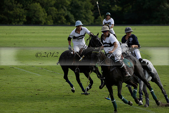 Pandas (white) v Home Farm (navy) in a Park House West Sussex Cup Polo match on Brooksfield at Cowdray Park Polo Club on Friday 30 August 2013. 2013.08.30 www.polopictures.co.uk