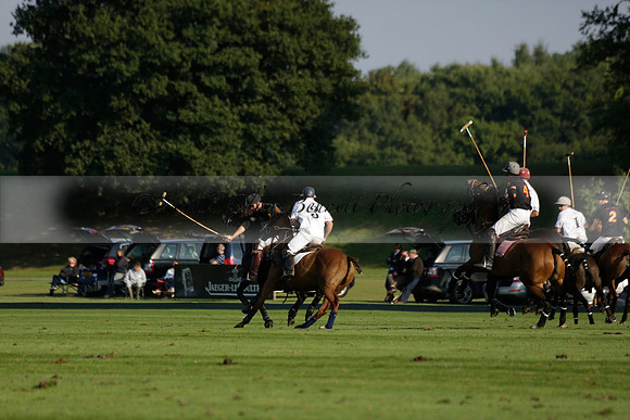 Pluma Negra (white) v Shoreline (black) in the Brecknock Cup Subsidiary final polo match played on Sunday 25 August 2013 at Cowdray Park Polo Club on Ambersham 1. 2013.10.12 www.polopictures.co.uk