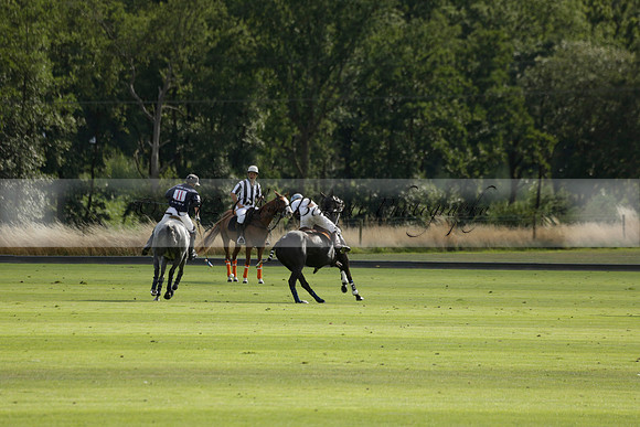 Pandas (white) v Home Farm (navy) in a Park House West Sussex Cup Polo match on Brooksfield at Cowdray Park Polo Club on Friday 30 August 2013. 2013.08.30 www.polopictures.co.uk