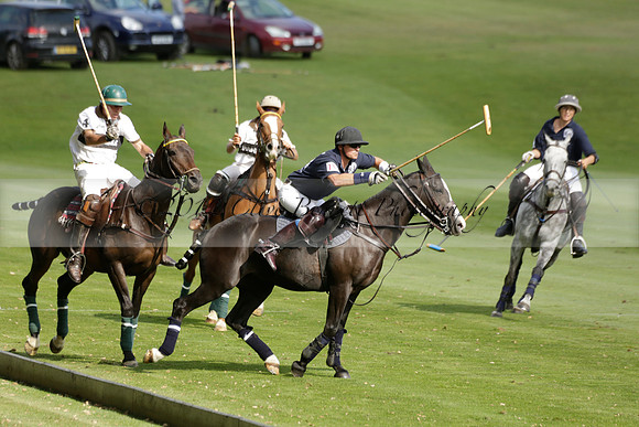 Pandas (white) v Home Farm (navy) in a Park House West Sussex Cup Polo match on Brooksfield at Cowdray Park Polo Club on Friday 30 August 2013. 2013.08.30 www.polopictures.co.uk
