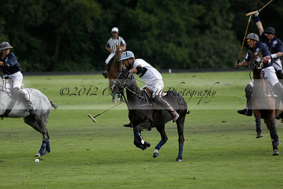 Pandas (white) v Home Farm (navy) in a Park House West Sussex Cup Polo match on Brooksfield at Cowdray Park Polo Club on Friday 30 August 2013. 2013.08.30 www.polopictures.co.uk
