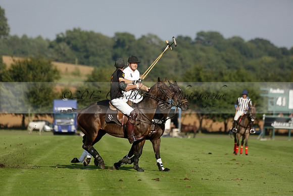 Pluma Negra (white) v Shoreline (black) in the Brecknock Cup Subsidiary final polo match played on Sunday 25 August 2013 at Cowdray Park Polo Club on Ambersham 1. 2013.10.12 www.polopictures.co.uk