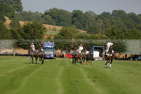 Pluma Negra (white) v Shoreline (black) in the Brecknock Cup Subsidiary final polo match played on Sunday 25 August 2013 at Cowdray Park Polo Club on Ambersham 1. 2013.10.12 www.polopictures.co.uk
