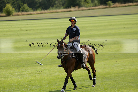Pandas (white) v Home Farm (navy) in a Park House West Sussex Cup Polo match on Brooksfield at Cowdray Park Polo Club on Friday 30 August 2013. 2013.08.30 www.polopictures.co.uk