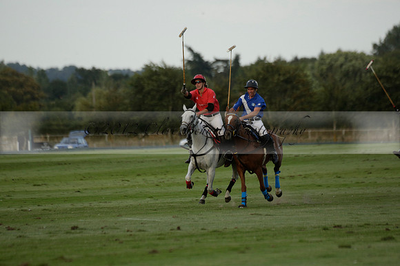 Ghost Chilli (blue) v Team Tonic (red) in a Lodsworth Cup Polo match on Ambersham 3 at Cowdray Park Polo Club on Friday 30 August 2013. 2013.08.30 www.polopictures.co.uk