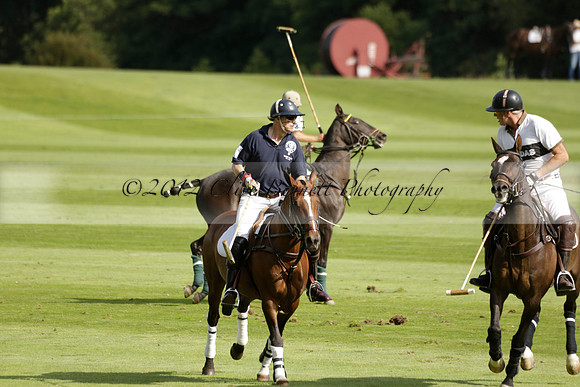 Pandas (white) v Home Farm (navy) in a Park House West Sussex Cup Polo match on Brooksfield at Cowdray Park Polo Club on Friday 30 August 2013. 2013.08.30 www.polopictures.co.uk