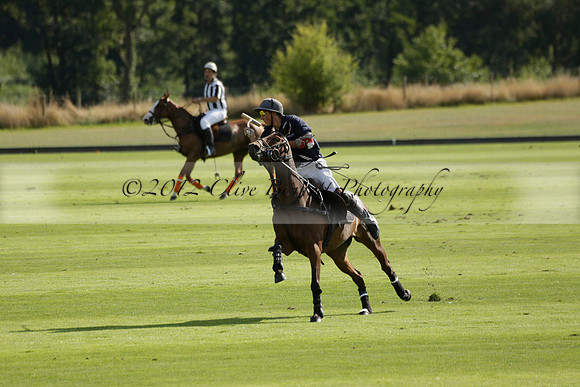 Pandas (white) v Home Farm (navy) in a Park House West Sussex Cup Polo match on Brooksfield at Cowdray Park Polo Club on Friday 30 August 2013. 2013.08.30 www.polopictures.co.uk
