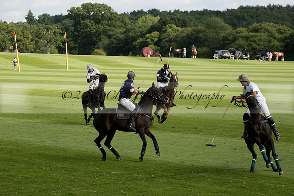 Pandas (white) v Home Farm (navy) in a Park House West Sussex Cup Polo match on Brooksfield at Cowdray Park Polo Club on Friday 30 August 2013. 2013.08.30 www.polopictures.co.uk