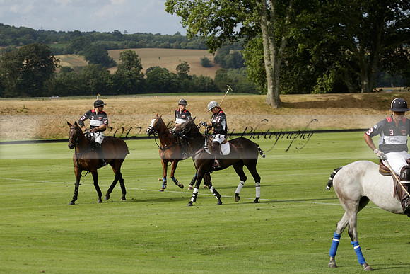 Jaeger Le Coultre (black)  v Wairakei Pastoral (white) in a Jaeger Le Coultre Holden White Cup polo match played on 29 July 2013 at Cowdray Park Polo Club on Brooksfieldwww.polopictures.co.uk