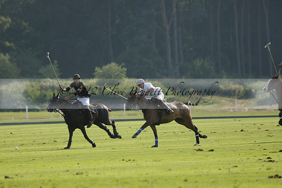 Pluma Negra (white) v Shoreline (black) in the Brecknock Cup Subsidiary final polo match played on Sunday 25 August 2013 at Cowdray Park Polo Club on Ambersham 1. 2013.10.12 www.polopictures.co.uk