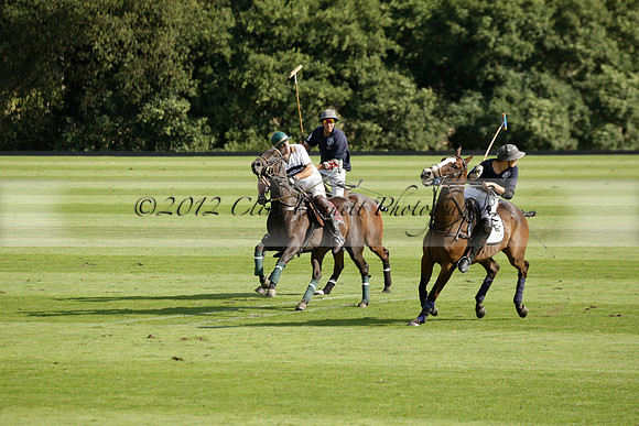 Pandas (white) v Home Farm (navy) in a Park House West Sussex Cup Polo match on Brooksfield at Cowdray Park Polo Club on Friday 30 August 2013. 2013.08.30 www.polopictures.co.uk