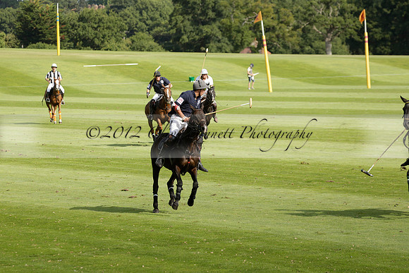 Pandas (white) v Home Farm (navy) in a Park House West Sussex Cup Polo match on Brooksfield at Cowdray Park Polo Club on Friday 30 August 2013. 2013.08.30 www.polopictures.co.uk