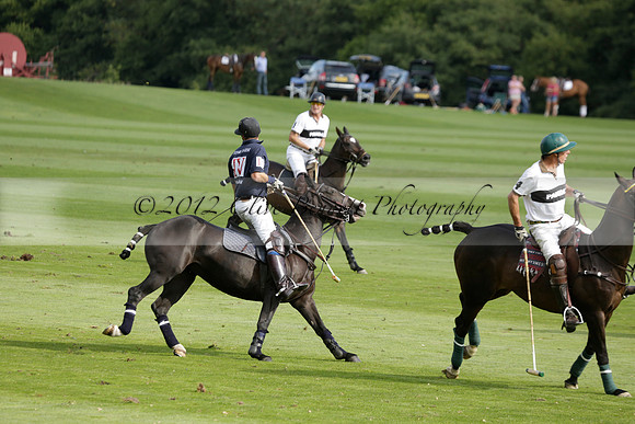 Pandas (white) v Home Farm (navy) in a Park House West Sussex Cup Polo match on Brooksfield at Cowdray Park Polo Club on Friday 30 August 2013. 2013.08.30 www.polopictures.co.uk