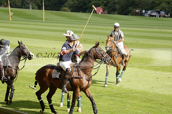 Pandas (white) v Home Farm (navy) in a Park House West Sussex Cup Polo match on Brooksfield at Cowdray Park Polo Club on Friday 30 August 2013. 2013.08.30 www.polopictures.co.uk