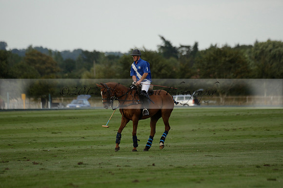 Ghost Chilli (blue) v Team Tonic (red) in a Lodsworth Cup Polo match on Ambersham 3 at Cowdray Park Polo Club on Friday 30 August 2013. 2013.08.30 www.polopictures.co.uk