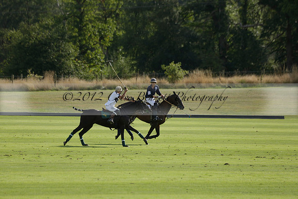 Pandas (white) v Home Farm (navy) in a Park House West Sussex Cup Polo match on Brooksfield at Cowdray Park Polo Club on Friday 30 August 2013. 2013.08.30 www.polopictures.co.uk