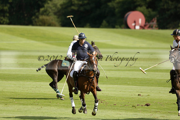 Pandas (white) v Home Farm (navy) in a Park House West Sussex Cup Polo match on Brooksfield at Cowdray Park Polo Club on Friday 30 August 2013. 2013.08.30 www.polopictures.co.uk