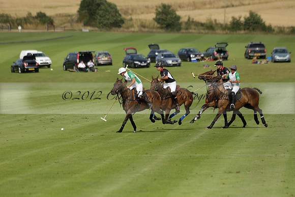 Jaeger Le Coultre (black)  v Wairakei Pastoral (white) in a Jaeger Le Coultre Holden White Cup polo match played on 29 July 2013 at Cowdray Park Polo Club on Brooksfieldwww.polopictures.co.uk
