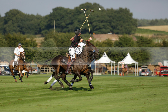 Pluma Negra (white) v Shoreline (black) in the Brecknock Cup Subsidiary final polo match played on Sunday 25 August 2013 at Cowdray Park Polo Club on Ambersham 1. 2013.10.12 www.polopictures.co.uk