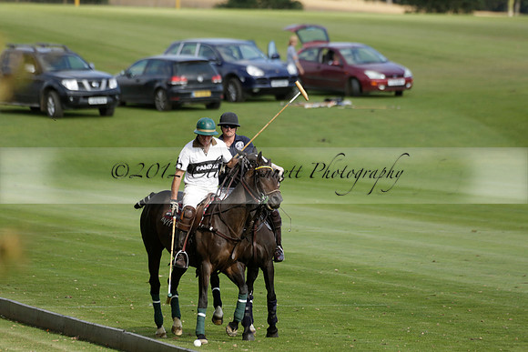 Pandas (white) v Home Farm (navy) in a Park House West Sussex Cup Polo match on Brooksfield at Cowdray Park Polo Club on Friday 30 August 2013. 2013.08.30 www.polopictures.co.uk