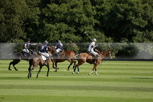 Pandas (white) v Home Farm (navy) in a Park House West Sussex Cup Polo match on Brooksfield at Cowdray Park Polo Club on Friday 30 August 2013. 2013.08.30 www.polopictures.co.uk