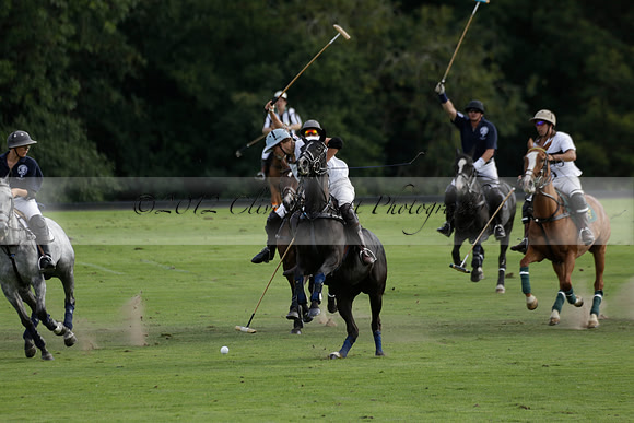 Pandas (white) v Home Farm (navy) in a Park House West Sussex Cup Polo match on Brooksfield at Cowdray Park Polo Club on Friday 30 August 2013. 2013.08.30 www.polopictures.co.uk