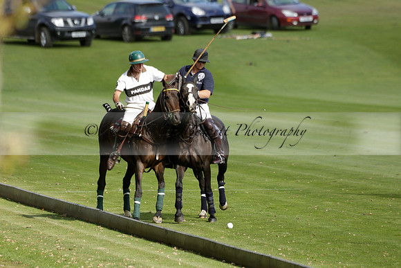 Pandas (white) v Home Farm (navy) in a Park House West Sussex Cup Polo match on Brooksfield at Cowdray Park Polo Club on Friday 30 August 2013. 2013.08.30 www.polopictures.co.uk