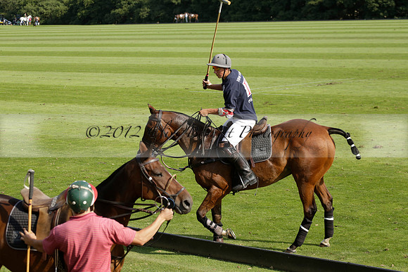 Pandas (white) v Home Farm (navy) in a Park House West Sussex Cup Polo match on Brooksfield at Cowdray Park Polo Club on Friday 30 August 2013. 2013.08.30 www.polopictures.co.uk
