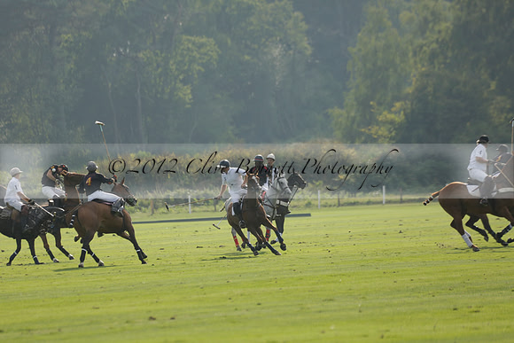 Pluma Negra (white) v Shoreline (black) in the Brecknock Cup Subsidiary final polo match played on Sunday 25 August 2013 at Cowdray Park Polo Club on Ambersham 1. 2013.10.12 www.polopictures.co.uk