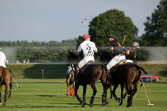 Pluma Negra (white) v Shoreline (black) in the Brecknock Cup Subsidiary final polo match played on Sunday 25 August 2013 at Cowdray Park Polo Club on Ambersham 1. 2013.10.12 www.polopictures.co.uk