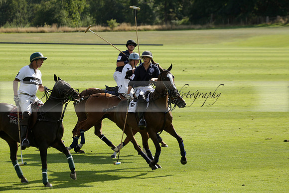 Pandas (white) v Home Farm (navy) in a Park House West Sussex Cup Polo match on Brooksfield at Cowdray Park Polo Club on Friday 30 August 2013. 2013.08.30 www.polopictures.co.uk