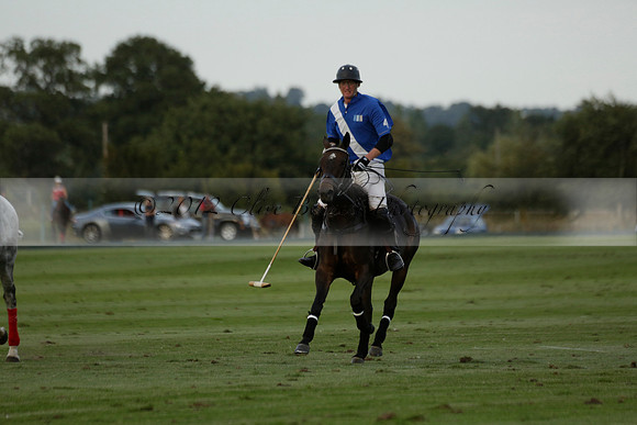 Ghost Chilli (blue) v Team Tonic (red) in a Lodsworth Cup Polo match on Ambersham 3 at Cowdray Park Polo Club on Friday 30 August 2013. 2013.08.30 www.polopictures.co.uk