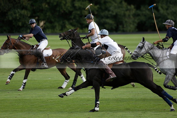 Pandas (white) v Home Farm (navy) in a Park House West Sussex Cup Polo match on Brooksfield at Cowdray Park Polo Club on Friday 30 August 2013. 2013.08.30 www.polopictures.co.uk