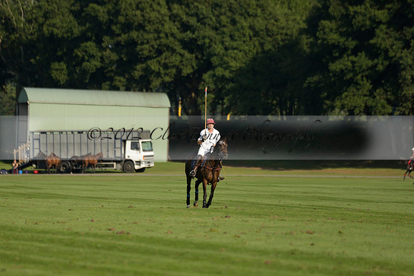 Pluma Negra (white) v Shoreline (black) in the Brecknock Cup Subsidiary final polo match played on Sunday 25 August 2013 at Cowdray Park Polo Club on Ambersham 1. 2013.10.12 www.polopictures.co.uk