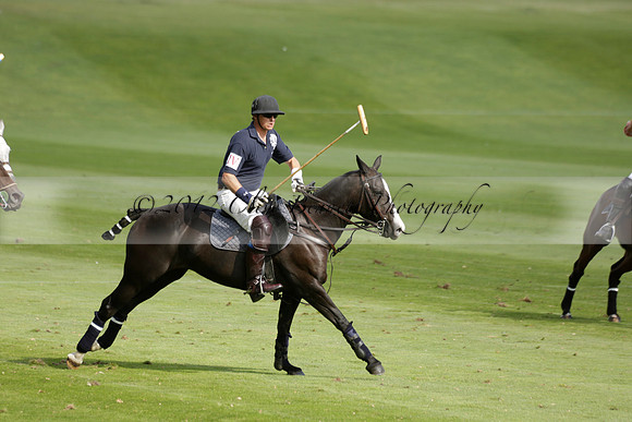 Pandas (white) v Home Farm (navy) in a Park House West Sussex Cup Polo match on Brooksfield at Cowdray Park Polo Club on Friday 30 August 2013. 2013.08.30 www.polopictures.co.uk