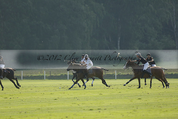 Pluma Negra (white) v Shoreline (black) in the Brecknock Cup Subsidiary final polo match played on Sunday 25 August 2013 at Cowdray Park Polo Club on Ambersham 1. 2013.10.12 www.polopictures.co.uk