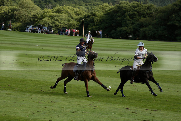 Pandas (white) v Home Farm (navy) in a Park House West Sussex Cup Polo match on Brooksfield at Cowdray Park Polo Club on Friday 30 August 2013. 2013.08.30 www.polopictures.co.uk