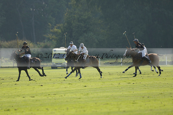 Pluma Negra (white) v Shoreline (black) in the Brecknock Cup Subsidiary final polo match played on Sunday 25 August 2013 at Cowdray Park Polo Club on Ambersham 1. 2013.10.12 www.polopictures.co.uk