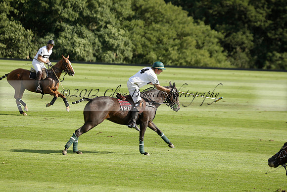 Pandas (white) v Home Farm (navy) in a Park House West Sussex Cup Polo match on Brooksfield at Cowdray Park Polo Club on Friday 30 August 2013. 2013.08.30 www.polopictures.co.uk