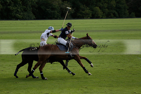Pandas (white) v Home Farm (navy) in a Park House West Sussex Cup Polo match on Brooksfield at Cowdray Park Polo Club on Friday 30 August 2013. 2013.08.30 www.polopictures.co.uk