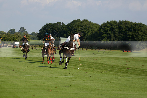 Pluma Negra (white) v Shoreline (black) in the Brecknock Cup Subsidiary final polo match played on Sunday 25 August 2013 at Cowdray Park Polo Club on Ambersham 1. 2013.10.12 www.polopictures.co.uk