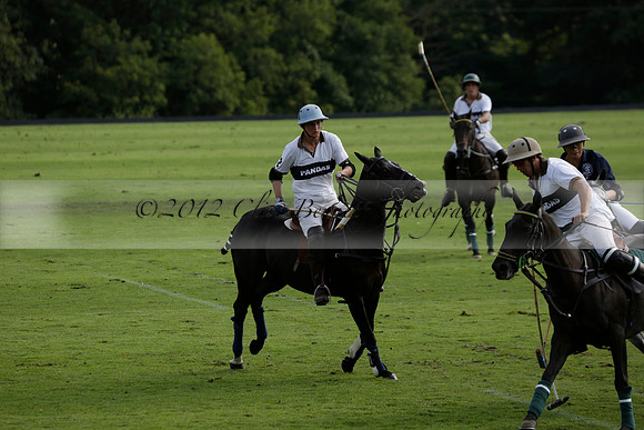 Pandas (white) v Home Farm (navy) in a Park House West Sussex Cup Polo match on Brooksfield at Cowdray Park Polo Club on Friday 30 August 2013. 2013.08.30 www.polopictures.co.uk