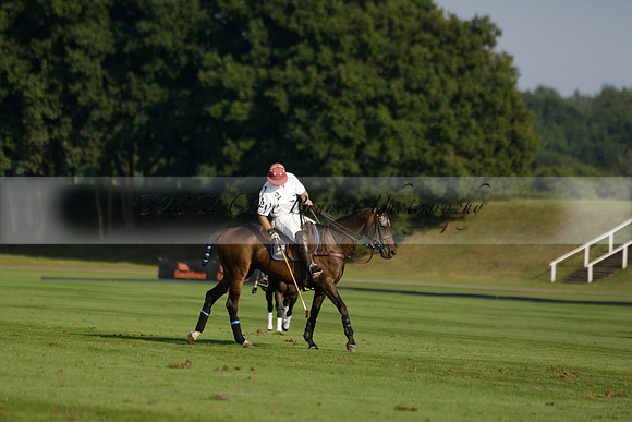 Pluma Negra (white) v Shoreline (black) in the Brecknock Cup Subsidiary final polo match played on Sunday 25 August 2013 at Cowdray Park Polo Club on Ambersham 1. 2013.10.12 www.polopictures.co.uk