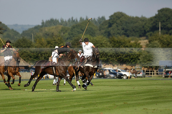 Pluma Negra (white) v Shoreline (black) in the Brecknock Cup Subsidiary final polo match played on Sunday 25 August 2013 at Cowdray Park Polo Club on Ambersham 1. 2013.10.12 www.polopictures.co.uk