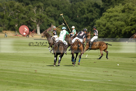 Jaeger Le Coultre (black)  v Wairakei Pastoral (white) in a Jaeger Le Coultre Holden White Cup polo match played on 29 July 2013 at Cowdray Park Polo Club on Brooksfieldwww.polopictures.co.uk
