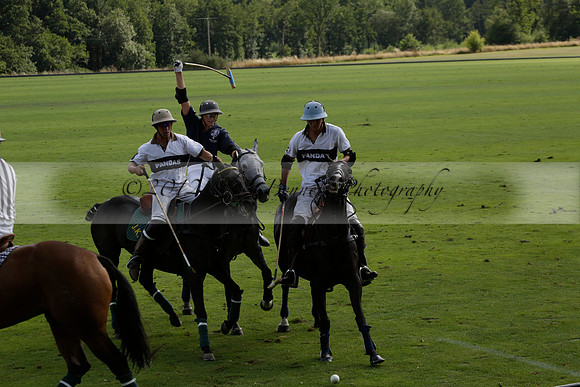 Pandas (white) v Home Farm (navy) in a Park House West Sussex Cup Polo match on Brooksfield at Cowdray Park Polo Club on Friday 30 August 2013. 2013.08.30 www.polopictures.co.uk