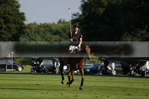 Pluma Negra (white) v Shoreline (black) in the Brecknock Cup Subsidiary final polo match played on Sunday 25 August 2013 at Cowdray Park Polo Club on Ambersham 1. 2013.10.12 www.polopictures.co.uk